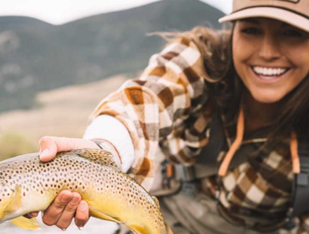 woman holding a fish