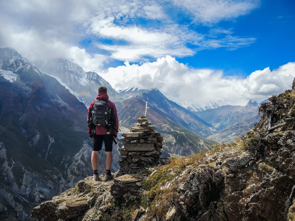 hiker on mountaintop in high contrast image